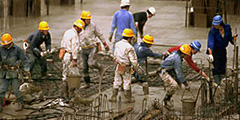 group of workmen on a busy construction site